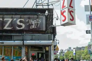 crowd in front of Katz's building during daytime