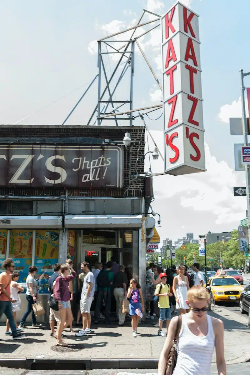 crowd in front of Katz's building during daytime